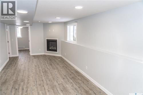 414 Nazarali Manor, Saskatoon, SK - Indoor Photo Showing Other Room With Fireplace