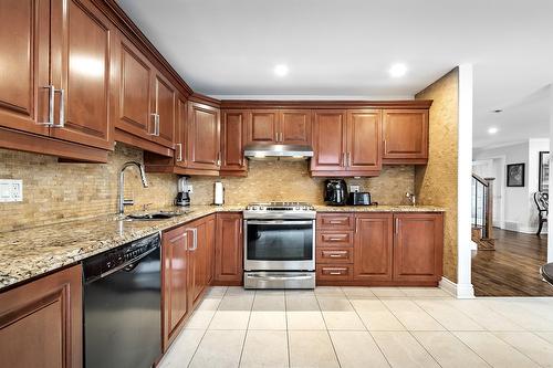 Cuisine - 230 Rue Mirabel, Dollard-Des-Ormeaux, QC - Indoor Photo Showing Kitchen With Upgraded Kitchen