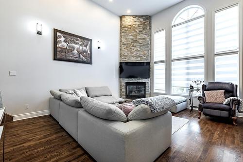 Salle familiale - 230 Rue Mirabel, Dollard-Des-Ormeaux, QC - Indoor Photo Showing Living Room With Fireplace