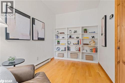 Living area with baseboard heating and light wood-type flooring - 9328 Wellinton Road 50, Erin, ON - Indoor
