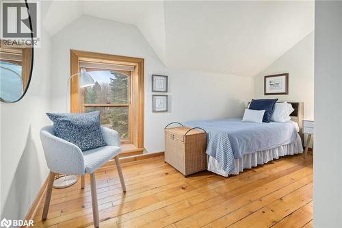 Bedroom featuring light wood-style floors and vaulted ceiling - 9328 Wellinton Road 50, Erin, ON - Indoor Photo Showing Bedroom