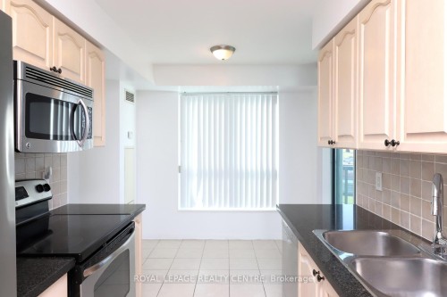 603-4850 Glen Erin Drive, Mississauga, ON - Indoor Photo Showing Kitchen With Double Sink