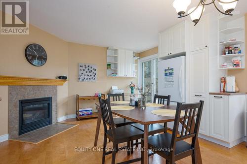 2557 Flannery Drive, Ottawa, ON - Indoor Photo Showing Dining Room With Fireplace