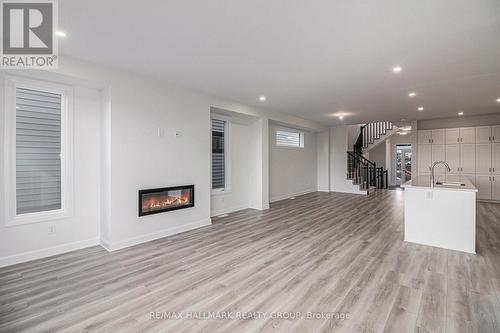 526 Reflection Street, Ottawa, ON - Indoor Photo Showing Other Room With Fireplace