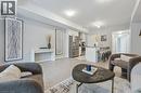 Living area with light wood finished floors and baseboards - 30 Oat Lane, Kitchener, ON  - Indoor Photo Showing Living Room 