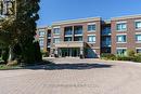 317 - 65 Via Rosedale, Brampton, ON  - Outdoor With Balcony With Facade 