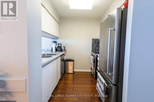 603 - 10 Laurelcrest Street, Brampton, ON - Indoor Photo Showing Kitchen With Double Sink