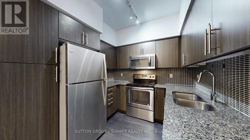 307 - 55 Speers Road N, Oakville, ON - Indoor Photo Showing Kitchen With Stainless Steel Kitchen With Double Sink