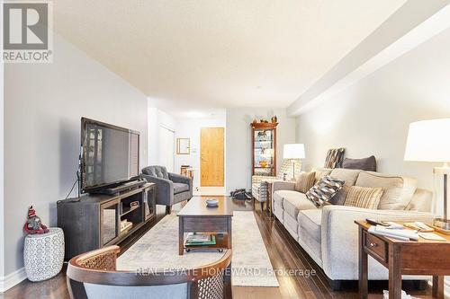 Living Room looking into foyer - 716 - 340 Watson Street W, Whitby, ON - Indoor Photo Showing Living Room