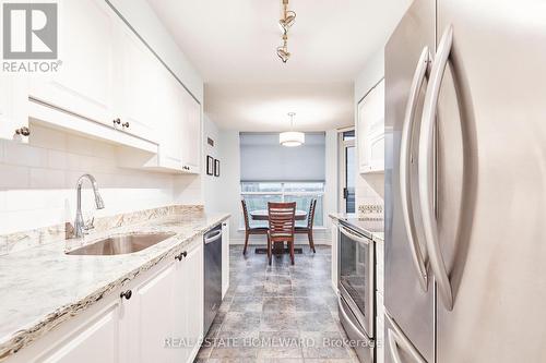Kitchen looking into dining room - 716 - 340 Watson Street W, Whitby, ON - Indoor Photo Showing Kitchen With Upgraded Kitchen