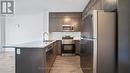 004 - 95 Dundas Street W, Oakville, ON  - Indoor Photo Showing Kitchen With Upgraded Kitchen 