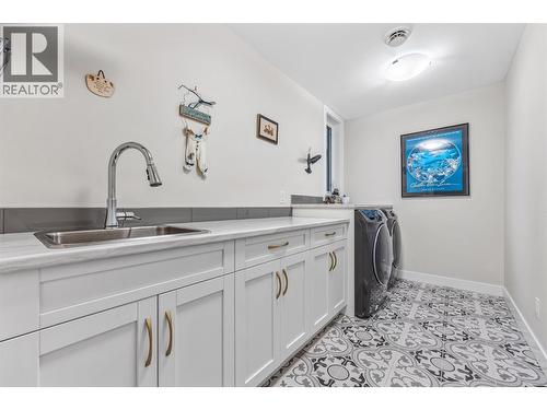 Laundry room downstairs - 9438 Ledgestone Road, Lake Country, BC - Indoor