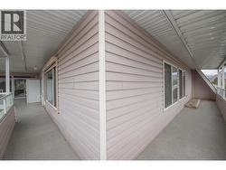 Wrap around by living and dining area windows - 