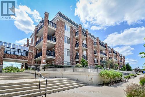 404 - 65 Bayberry Drive, Guelph (Village By The Arboretum), ON - Outdoor With Balcony With Facade