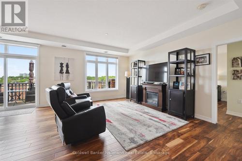 404 - 65 Bayberry Drive, Guelph (Village By The Arboretum), ON - Indoor Photo Showing Living Room With Fireplace