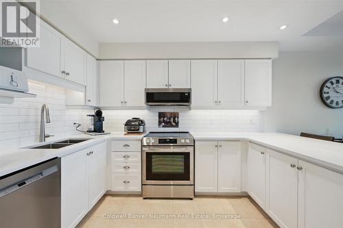 404 - 65 Bayberry Drive, Guelph (Village By The Arboretum), ON - Indoor Photo Showing Kitchen With Double Sink