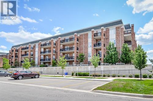 404 - 65 Bayberry Drive, Guelph (Village By The Arboretum), ON - Outdoor With Balcony With Facade