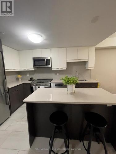 Quartz Countertops - 205 - 63 Arthur Street S, Guelph (St. Patrick'S Ward), ON - Indoor Photo Showing Kitchen With Double Sink With Upgraded Kitchen