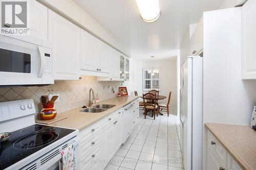 30 - 1415 Hazelton Boulevard, Burlington, ON - Indoor Photo Showing Kitchen With Double Sink
