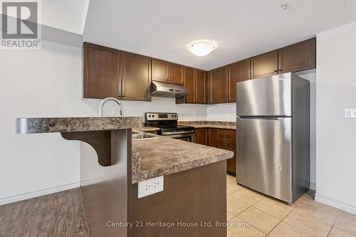 206 - 60 Lynnmore Street, Guelph (Pineridge/Westminster Woods), ON - Indoor Photo Showing Kitchen With Double Sink
