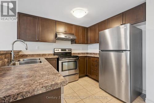 206 - 60 Lynnmore Street, Guelph (Pineridge/Westminster Woods), ON - Indoor Photo Showing Kitchen With Double Sink