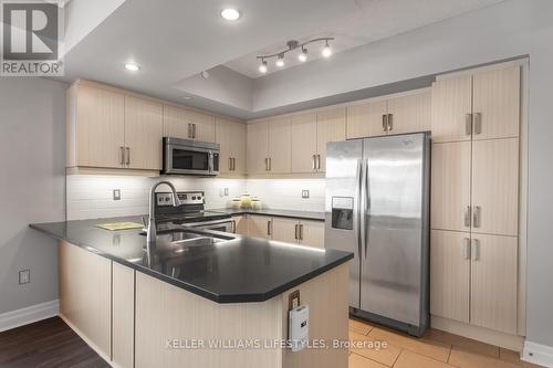 409 - 89 Ridout Street, London South (South F), ON - Indoor Photo Showing Kitchen With Stainless Steel Kitchen With Double Sink With Upgraded Kitchen