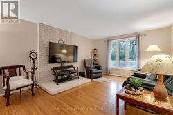 Family room with attractive brick accent wall - 