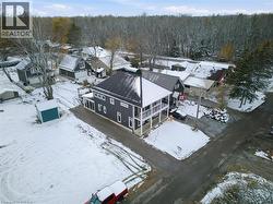 Snowy aerial view with a residential view and a forest view - 