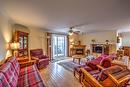 Salon - 101-1245 Rue François-Corbeil, Terrebonne (Terrebonne), QC  - Indoor Photo Showing Living Room With Fireplace 