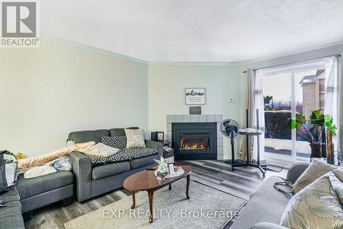 115 - 735 Deveron Crescent, London South, ON - Indoor Photo Showing Living Room With Fireplace