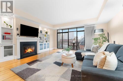 401 - 374 Cooper Street, Ottawa, ON - Indoor Photo Showing Living Room With Fireplace