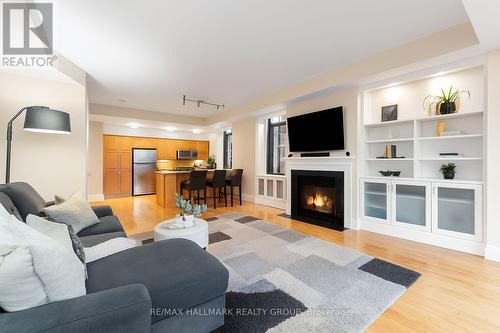 401 - 374 Cooper Street, Ottawa, ON - Indoor Photo Showing Living Room With Fireplace