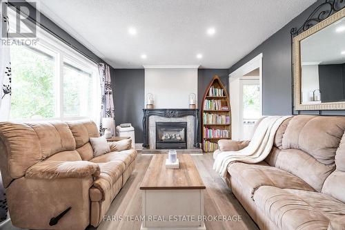 8304 County Road 169, Severn, ON - Indoor Photo Showing Living Room With Fireplace