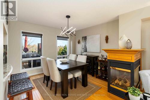 1584 Woodhenge Way, Mississauga, ON - Indoor Photo Showing Dining Room With Fireplace
