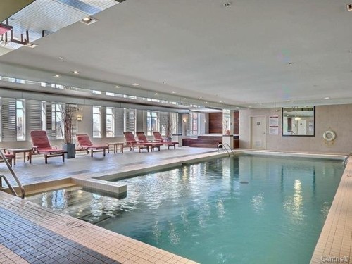 Piscine - 514-2160 Av. Terry-Fox, Laval (Chomedey), QC - Indoor Photo Showing Other Room With In Ground Pool