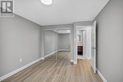 Primary bedroom, mirrored closet doors. - 