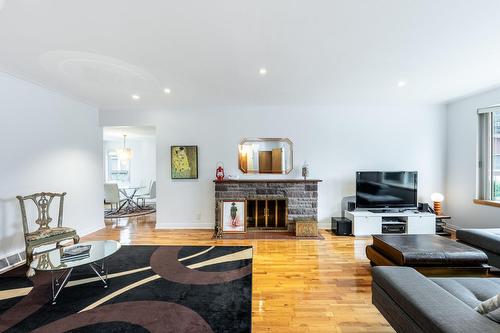 Vue d'ensemble - 15221 Rue Théorêt, Montréal (L'Île-Bizard/Sainte-Geneviève), QC - Indoor Photo Showing Living Room With Fireplace