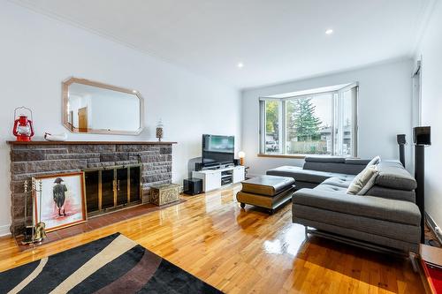 Salon - 15221 Rue Théorêt, Montréal (L'Île-Bizard/Sainte-Geneviève), QC - Indoor Photo Showing Living Room With Fireplace