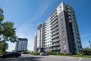Vue d'ensemble - 109-7620 Boul. Marie-Victorin, Brossard, QC  - Outdoor With Balcony With Facade 