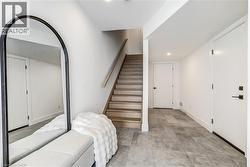 Stairway featuring baseboards and recessed lighting - 