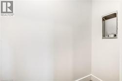 Spare room featuring baseboards - 