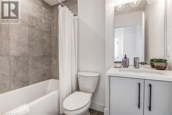 Full bathroom featuring vanity and shower / bath combination with curtain - 