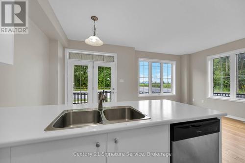 View of large windows shedding natural light - 9 - 8273 Tulip Tree Drive, Niagara Falls, ON 