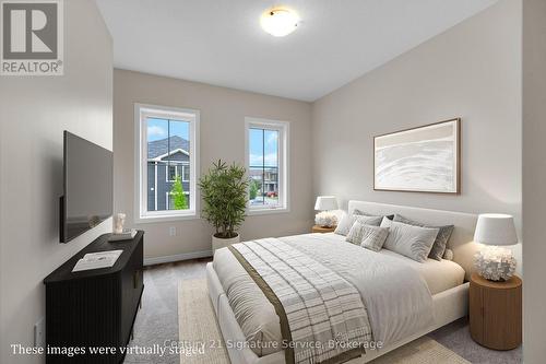 Virtually staged Front Bedroom #1 - 9 - 8273 Tulip Tree Drive, Niagara Falls, ON 