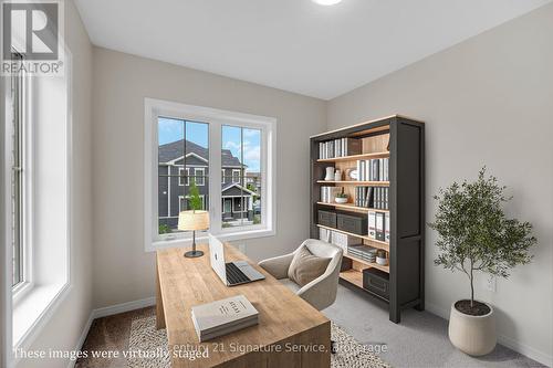 Virtually staged side Bedroom #2 as Office - 9 - 8273 Tulip Tree Drive, Niagara Falls, ON 