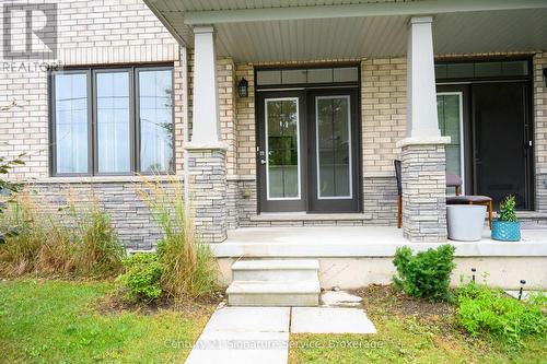 View from fence of garden door entry to kitchen - 9 - 8273 Tulip Tree Drive, Niagara Falls, ON 