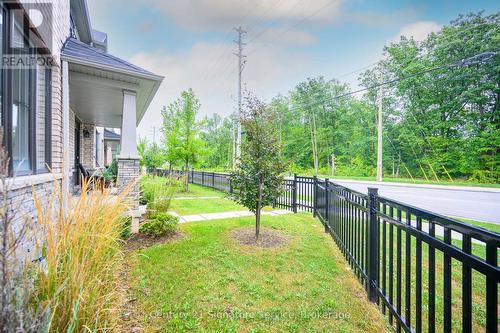 View of forested area out the rear of the unit - 9 - 8273 Tulip Tree Drive, Niagara Falls, ON 