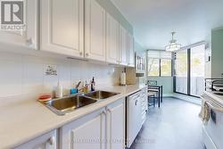 Galley style kitchen with breakfast area - 