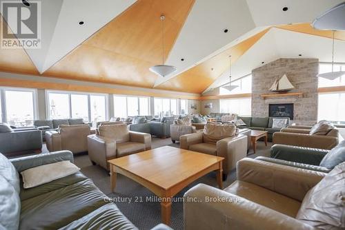 12 - 293 Mariners Way, Collingwood, ON - Indoor Photo Showing Living Room With Fireplace