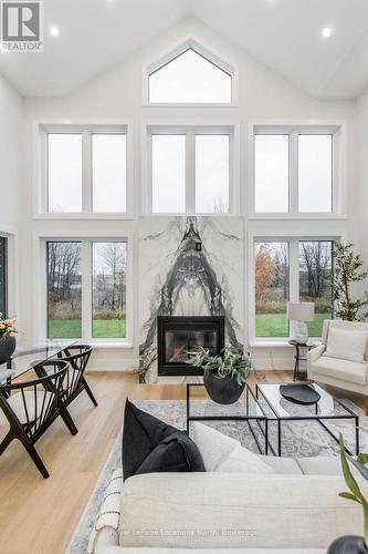 6 Butternut Crescent, Wasaga Beach, ON - Indoor Photo Showing Living Room With Fireplace